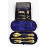A hallmarked silver cased manicure set, indistinctly signed, and a cased silver gilt christening