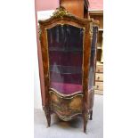 A late 19th century French Louis XV style serpentine kingwood vitrine, with glazed and panelled