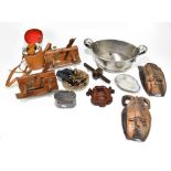 A group of collectors' items including a pair of planes, pair of wall masks, oval planter,