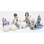 LLADRO; 'All Aboard', a figure of a boy with a train, length 19cm, with a Lladro figure of a