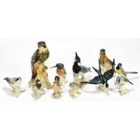 KARL ENZ; a collection of eleven ceramic bird figures, height of largest example 25cm (11).