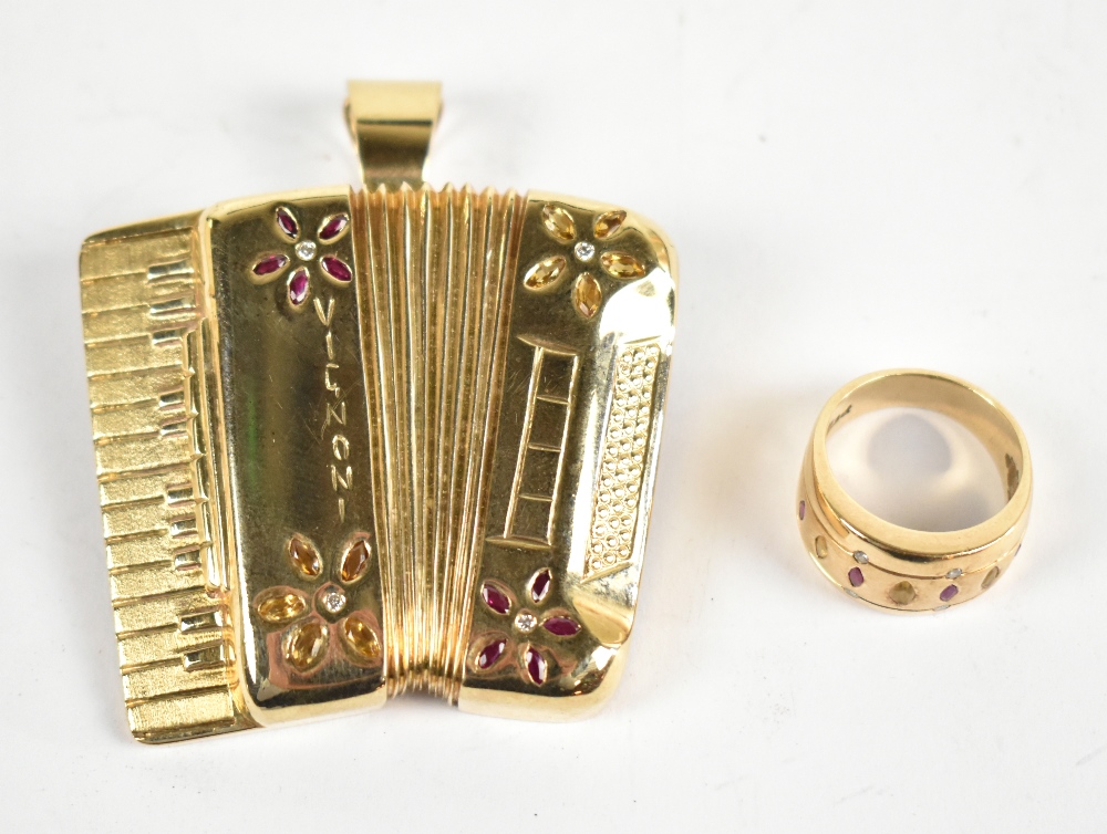 A novelty yellow metal brooch pendant in the form of a Vignoni piano accordion, gem set and