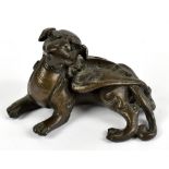 A 19th century Chinese bronze scroll weight modelled as a Dog of Fo, length 7cm. Provenance: private