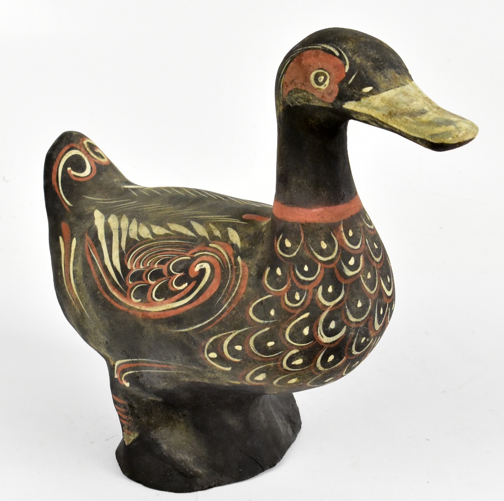 A Chinese Han Dynasty lacquered model of a duck with polychrome decoration, length 31cm.