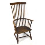 A 19th century beech and ash high back country kitchen chair, with solid saddle seat, on turned