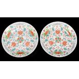 A pair of 19th century Chinese small shallow dishes, probably Tongzhi (1862-1874), each painted with