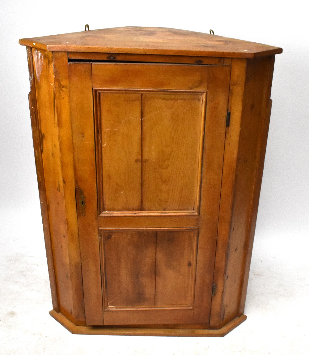 A pine hanging corner cupboard, width 88cm, depth 54cm, height 118cm.