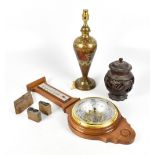 An Indian carved hardwood jar and cover, with three printers' stamps, a brass lamp and a modern