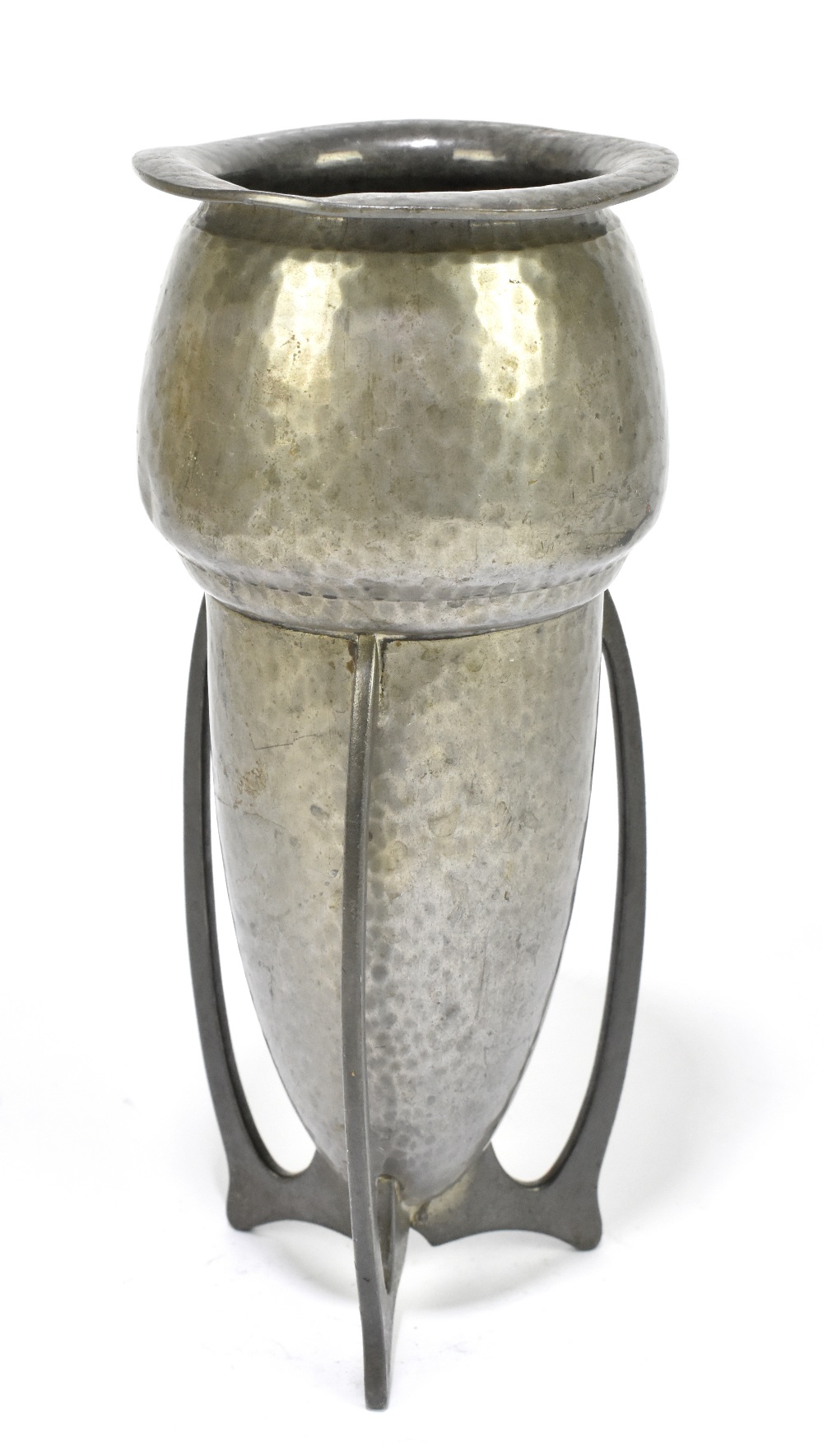 LIBERTY & CO; a hammered pewter rocket vase, with three pierced swept supports, indistinctly stamped