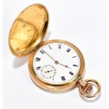 A gold plated crown wind full hunter pocket watch, the enamel dial set with Roman numerals and