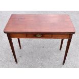 An early 19th century mahogany tea table with single drawer to the frieze, raised on square