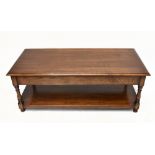 A reproduction oak two tier coffee table of rectangular form.