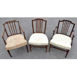 A set of eight early 19th century mahogany dining chairs, each with vertical splat backs, padded