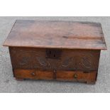 *****WITHDRAWN***** An 18th century oak coffer bach, the hinged lid above carved detail to the