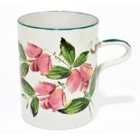 WEMYSS WARE; an oversized mug painted with floral decoration, painted and impressed marks, a