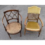 A cane seated stained beech elbow chair and an Arts & Crafts style elbow chair (2)
