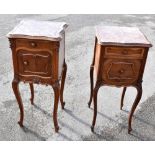 A near pair of French walnut marble topped bedside cabinets on cabriole legs, width 39cm.