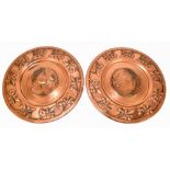 WMF; a pair of copper circular chargers, embossed to the centre, with portrait representing a Greek