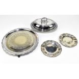 A pair of Indian white metal dishes with chased decoration depicting elephant, crab, camels,