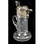 A late Victorian/Edwardian cut glass silver plate mounted claret jug, the hinged lid surmounted with