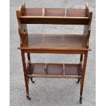 An Edwardian mahogany satinwood crossbanded and boxwood inlaid two tiered book trough, in the Arts &