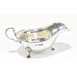 C W FLETCHER & SON LTD; a George V hallmarked silver sauceboat with cast rim, Sheffield 1934,