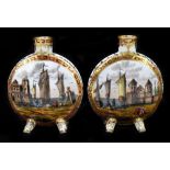 A pair of early 20th century Continental hand painted porcelain moon flasks, decorated with