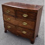 A 19th century mahogany bowfronted chest of two short and two long drawers, raised on splayed