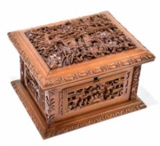 A circa 1900 Chinese finely carved sandalwood box, the hinged lid enclosing a velvet lined