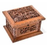 A circa 1900 Chinese finely carved sandalwood box, the hinged lid enclosing a velvet lined