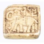 An unusual antique white marble tablet, carved with an elephant, 6.2 x 5.7cm. Provenance: private