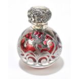 An Edward VII hallmarked silver mounted cranberry glass scent bottle, with floral decoration, with
