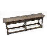 An 18th century oak rectangular bench of joined construction in the manner of a joint stool, the