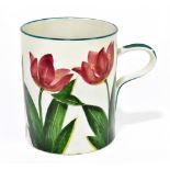 WEMYSS WARE; an oversized mug decorated with tulips, impressed marks and printed retailer stamp