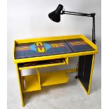 A bespoke computer desk made from original panels from a 1976 Space Invaders arcade machine,
