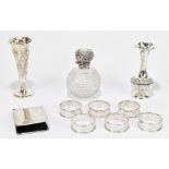 E. EDMONDS; a set of six George V hallmarked silver napkin rings with pierced Greek Key