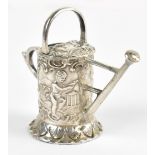 A Dutch silver novelty watering can decorated with scrolls and children, height 5cm.