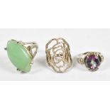 A white metal ring set with mystic topaz style oval stone, stamped 14K 585, 4.9g, decorative