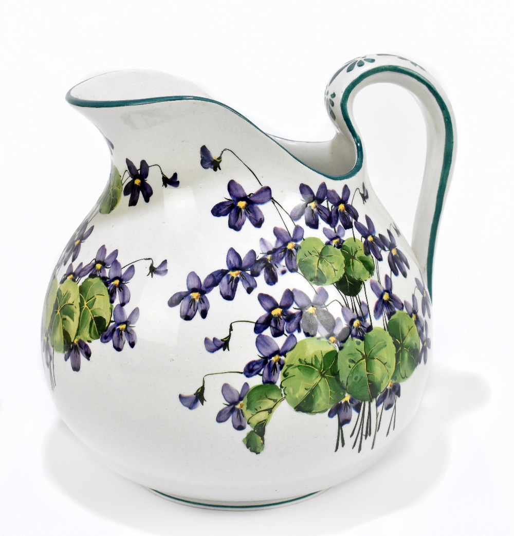 WEMYSS WARE; a large bulbous jug painted with violets, painted signature to underside, height 24cm.