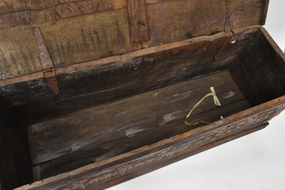 An 18th century blanket box, the hinged lid above a Gothic carved panel front, width 151cm, depth - Bild 8 aus 8