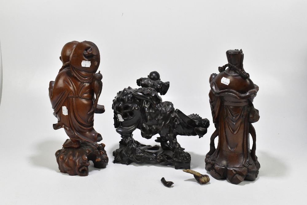 Three Chinese carved hardwood figures, one a boy and a sage with a tortoise and another with an - Bild 3 aus 7