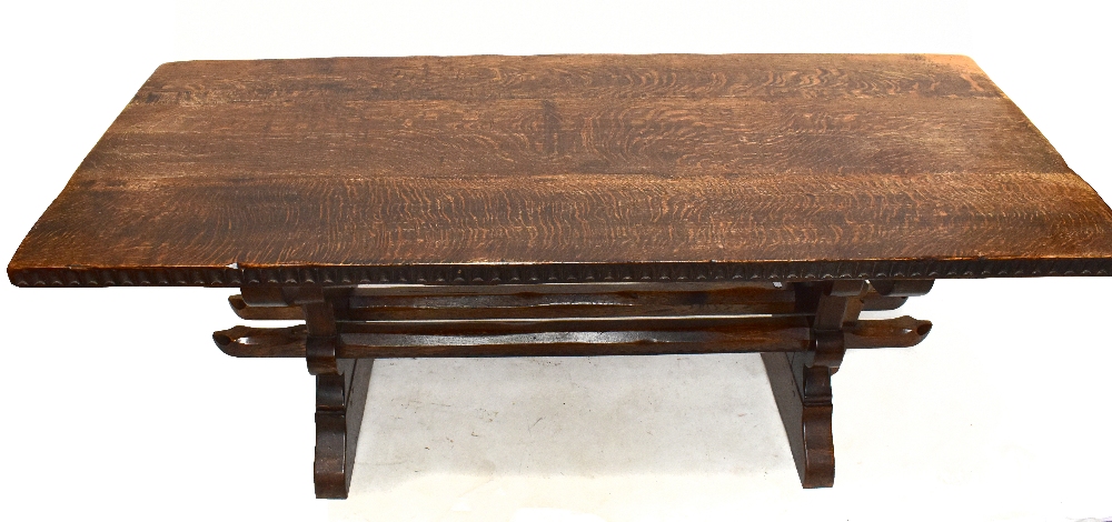 A reproduction oak refectory table on baluster feet, width 183cm, depth 76cm, height 73cm.