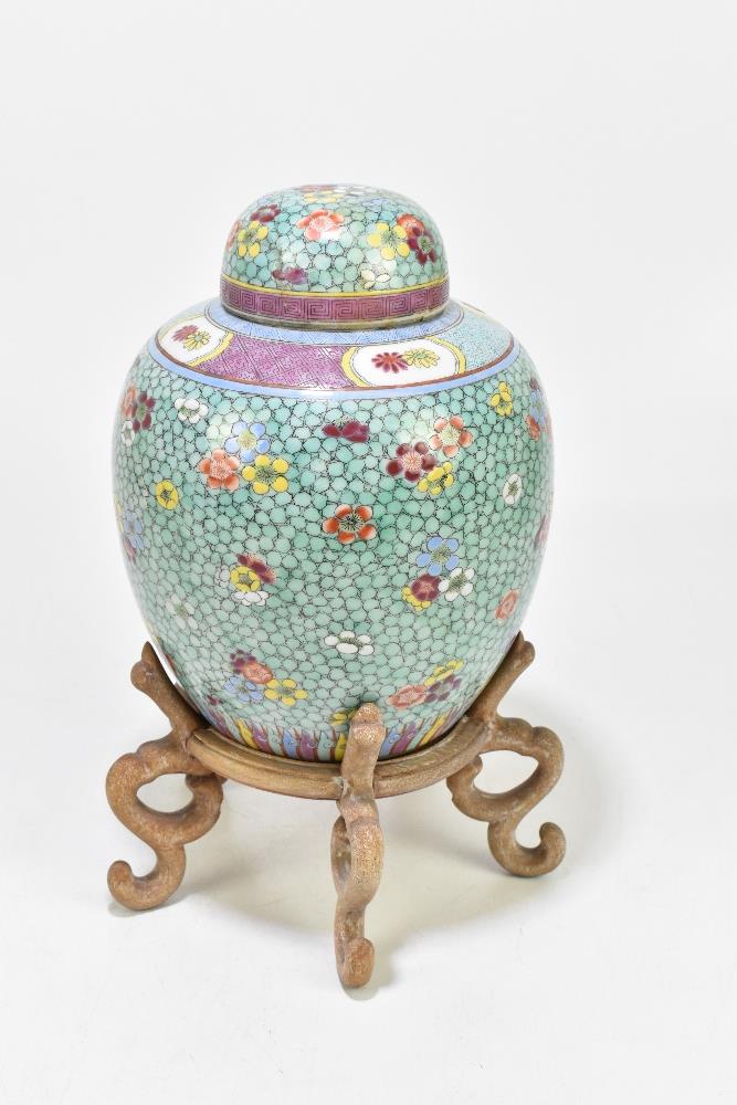 A late 19th century Chinese Famille Rose jar and cover, enamel painted with floral sprays on a - Image 4 of 8