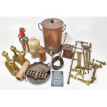 A quantity of mixed metalware to include a copper tea urn, a pair of brass fire dogs and a stoneware