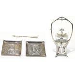 WMF; a polished metal preserve jar stand, the frame with pierced stylised decoration, with