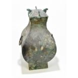 A Chinese Han Dynasty (206 BC - 220 AD) bronze Hu vase and cover, with twin ring Taotie masks and