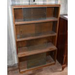 MINTY OF OXFORD; an oak freestanding four section bookcase, width 89cm.