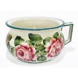 WEMYSS WARE; a chamber pot painted with cabbage roses, painted marks to the underside, width 26cm.
