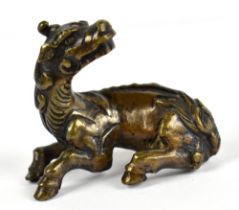 An 19th century Chinese scroll weight modelled as a kylin, length 5cm. Provenance: private