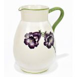 WEMYSS WARE; an unusual jug of bulbous form painted with purple floral detail below a green rim